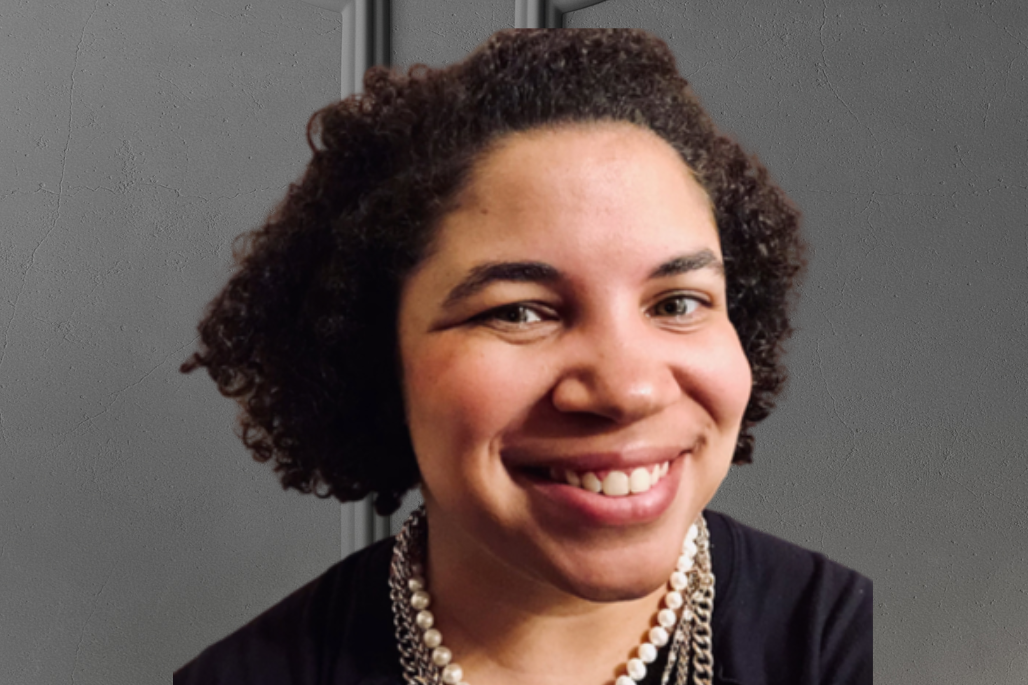 Close-up headshot of Dr. Latoya Hinton smiling