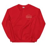 Front of motivational women's empowerment red crewneck sweatshirt with small "Dreams Turning" chest logo