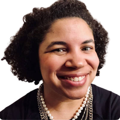 Headshot of Dr. Latoya Hinton smiling in a black top and pearl necklace